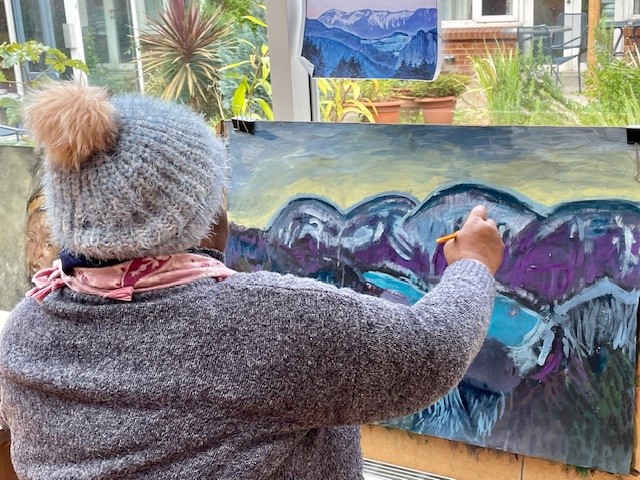 A Look Ahead resident painting a meaningful piece of art to be displayed at the Bit by bit exhibition.